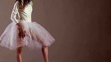 Blonde gymnast just casually showing off moves in a naked workout.