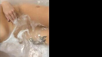 pretty woman masturbates in hot tub, ends with bright cumshot