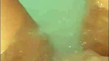 pretty woman masturbates in hot tub, ends with bright cumshot