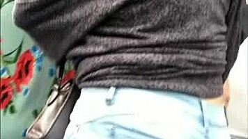 teen latina with tight jeans showing off her curves in a voyeur scene