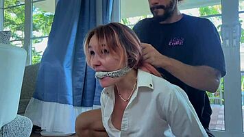 this tied-up babe is helpless in bondage. she has to obey every tickle on her cute feet.