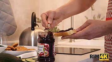 Sexy redhead girlfriend kicks off the morning with rimming and blowjob in the kitchen. Her shaved pussy adds extra spice