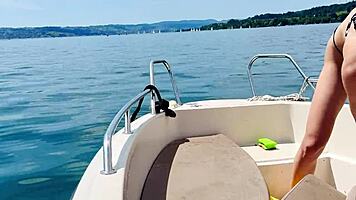 blonde housewife washes boat in sexy thong swimsuit for summer fun.