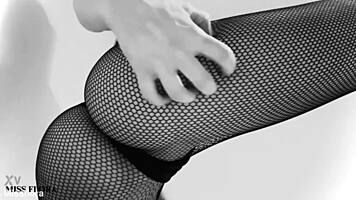 Fishnet-clad ass teases feet in black and white!