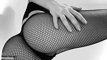 Fishnet-clad ass teases feet in black and white!
