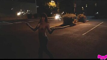 Just chilling topless outdoors with Honey Gold and Dakota Marr flashing sparklers.