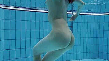 Anna netrebko teases in bikini while swimming in the pool, showing off her petite figure.