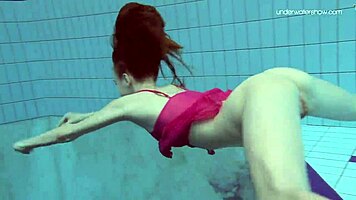 Anna netrebko teases in bikini while swimming in the pool, showing off her petite figure.