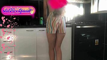 Sol tidies the kitchen