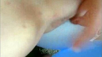 Sophie wears jeans and miniskirt while on webcam.