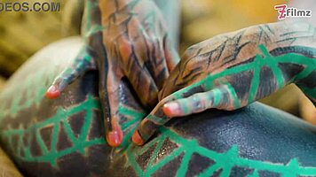 Tattoo girl feels pleasure in solo anal play with big dildo in sexy fishnets