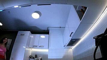 Hottest Redhead Tattooed Cheerleader With Over Knee Socks Shows Her See Through Panties In The Kitchen