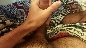 Handsome Brazilian Guy Masturbates Lying Down with Huge Cock and Spread Legs