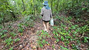 thai girl chats while picking mushrooms in the forest 😊