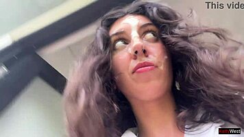 Enjoying a mouthful of pizza on the street in a public cafe with beautiful teen