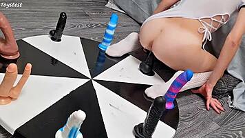 Petite girl wins orgasm playing wheel of dildos
