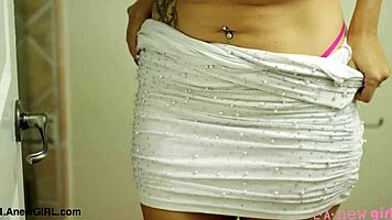 Smoldering brunette beauty enjoys a relaxing shower