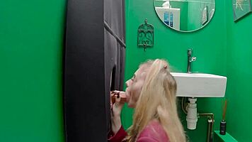 Teen eagerly sucks cock at the gloryhole