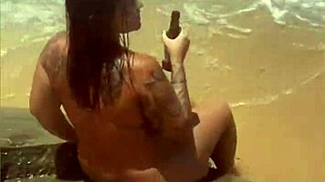 Young African Woman Flashes On The Beach