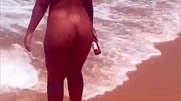 Young African Woman Flashes On The Beach