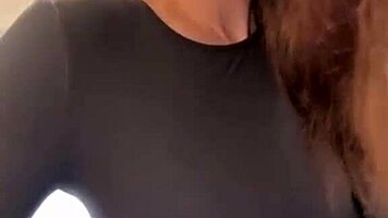 woman caresses her milky tits until she orgasms