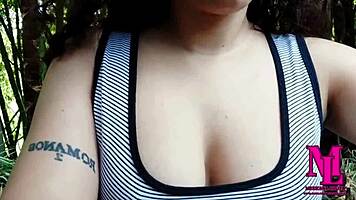 Feeling the intense orgasm as she squirts outdoors