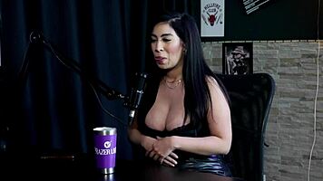 Amy Yamaguchi in sheer red lingerie engages in hotwife swing with sixteen men in group sex.