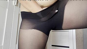 Young woman without panties in transparent pantyhose