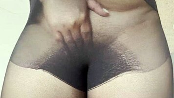 Young woman without panties in transparent pantyhose