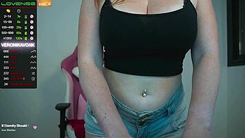 Horny redhead girl plays with huge tits and dildo online!