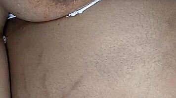 Is this ebony woman masturbating in her room alone?