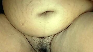 Is this ebony woman masturbating in her room alone?