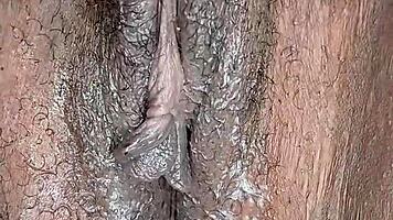 Is this ebony woman masturbating in her room alone?