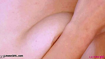 Alluring brunette shows sexy body on sofa