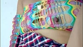 opening her pussy and inserting a pink dildo she shows her wet pussy