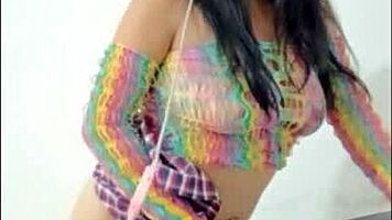 opening her pussy and inserting a pink dildo she shows her wet pussy