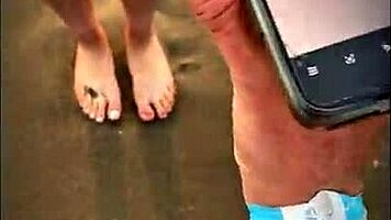 brunette latina babe gives pov blowjob on public beach