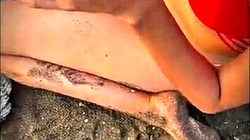 brunette latina babe gives pov blowjob on public beach