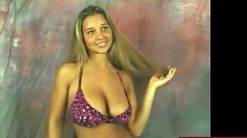 Watch busty Christina rip clothes while dancing in purple bikini!
