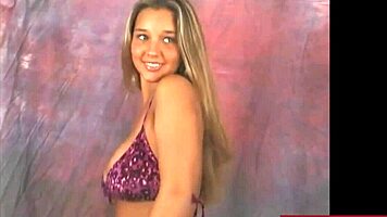 Watch busty Christina rip clothes while dancing in purple bikini!