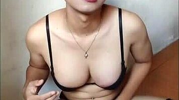 An amateur shemale in black bra and stockings cumming on handkerchief