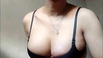 An amateur shemale in black bra and stockings cumming on handkerchief