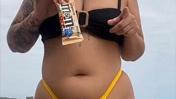 Young african woman in tight yellow bikini at usa beach