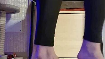 Woman in Black Leggings Teases with Subtle Fingering