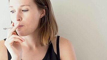 Petite Brunette Teases Smoking with Blue Eyes Voyeur