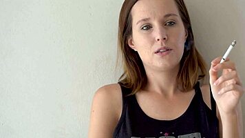 Petite Brunette Teases Smoking with Blue Eyes Voyeur