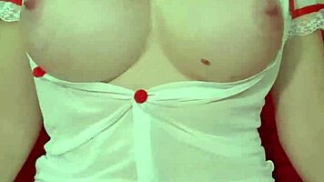 Pretty blonde teases huge tits in see-through dress close-up amateur