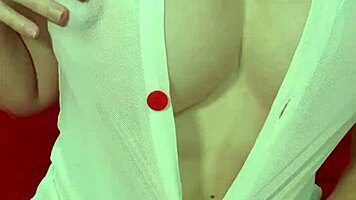 Pretty blonde teases huge tits in see-through dress close-up amateur