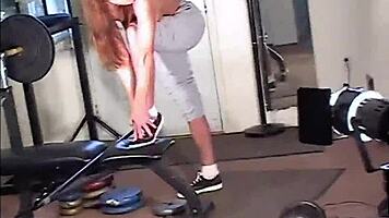 maria shadoes flexes redhead milf curves in gym bts