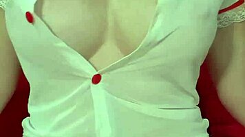 Pretty blonde teases huge tits in see-through dress close-up amateur